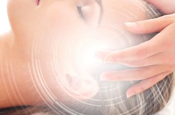 Young attractive woman getting spa treatment over white background